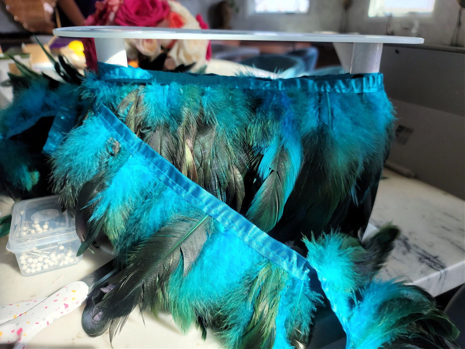 DIY Counter Stools by popular Colorado home design blog, Eclectic Twist: image of blue, black and green feather trim. 
