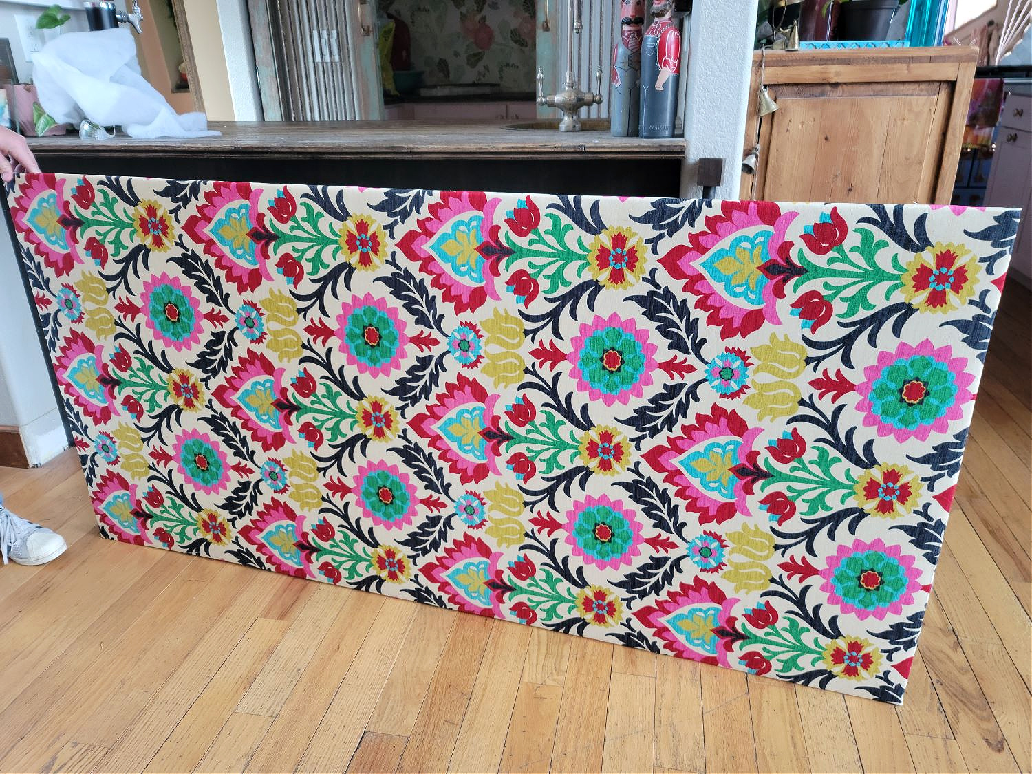 Upholstered Cabinet Panel by popular CO home design blog, Eclectic Twist: image of a plywood board covered in Waverly fabric.