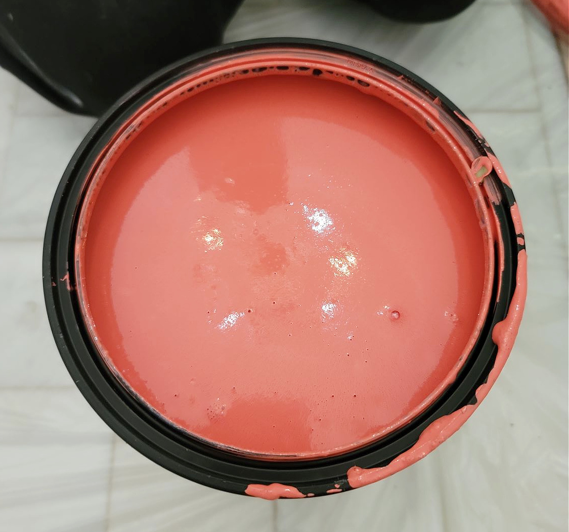 Mixing Your Own Paint Color by popular CO Home Design blog, Eclectic Twist: image of coral pink paint in a black paint can. 