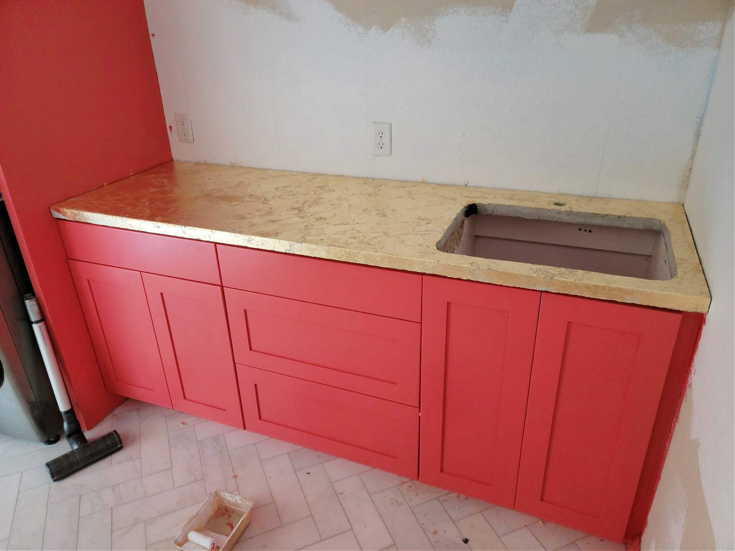 How to Gold Leaf by popular CO home design blog, Eclectic Twist: image of coral cabinets with a gold leaf countertop. 