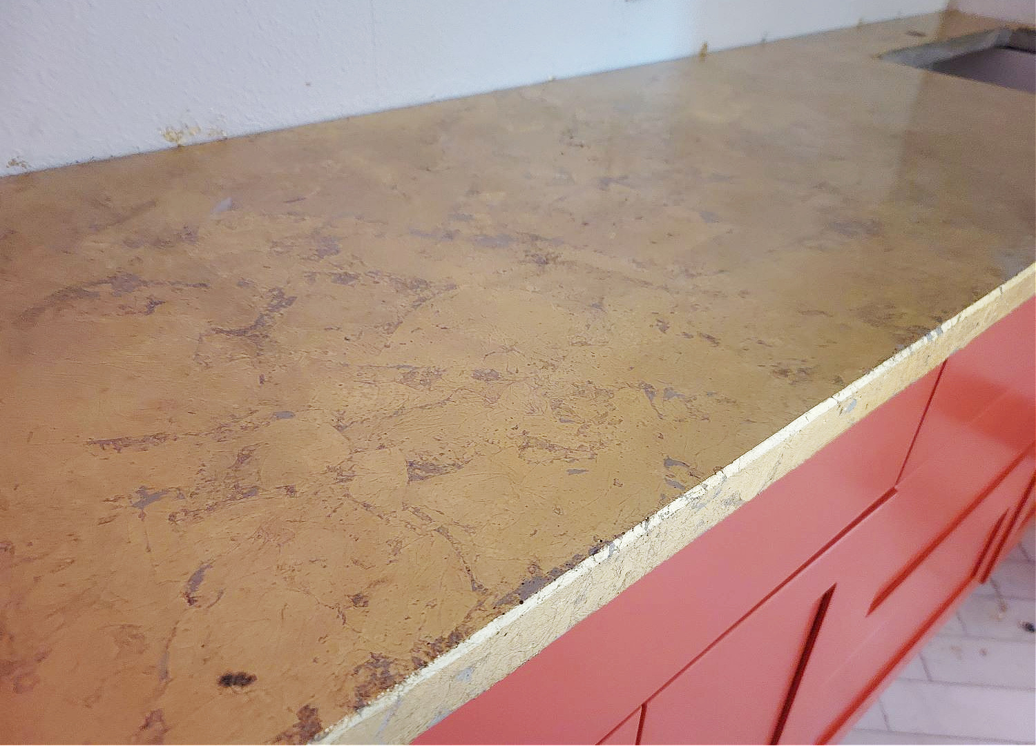 How to Gold Leaf by popular CO home design blog, Eclectic Twist: image of coral cabinets with a gold leaf counters. 
