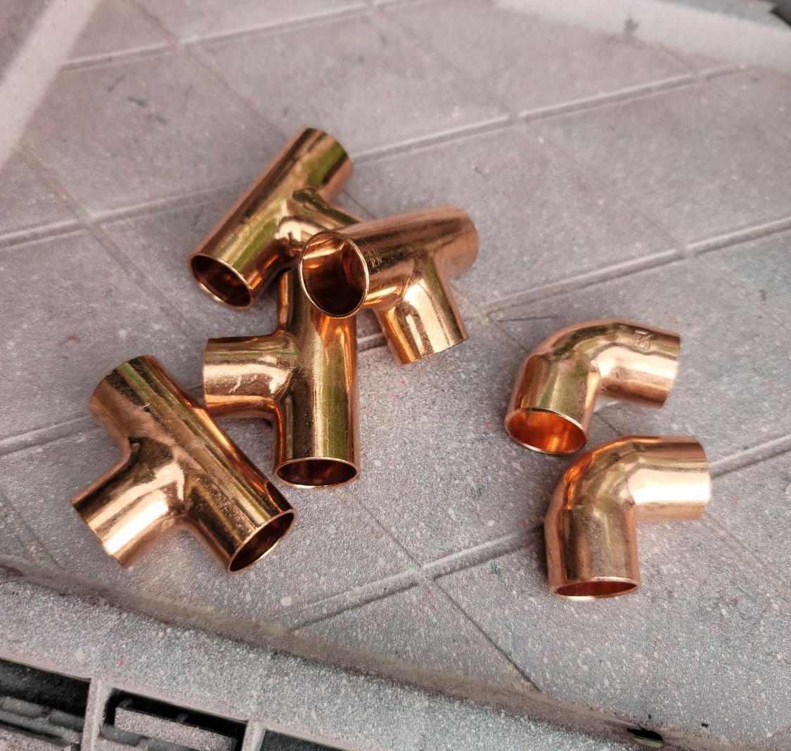 DIY Open Shelving by popular CO home design blog, Eclectic Twist: image of copper T and elbow pieces. 